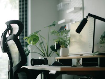 Comfortable office workspace with ergonomic chair and soft lighting